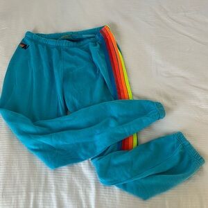 Aviator Nation Blue Track Pants with Rainbow Stripes